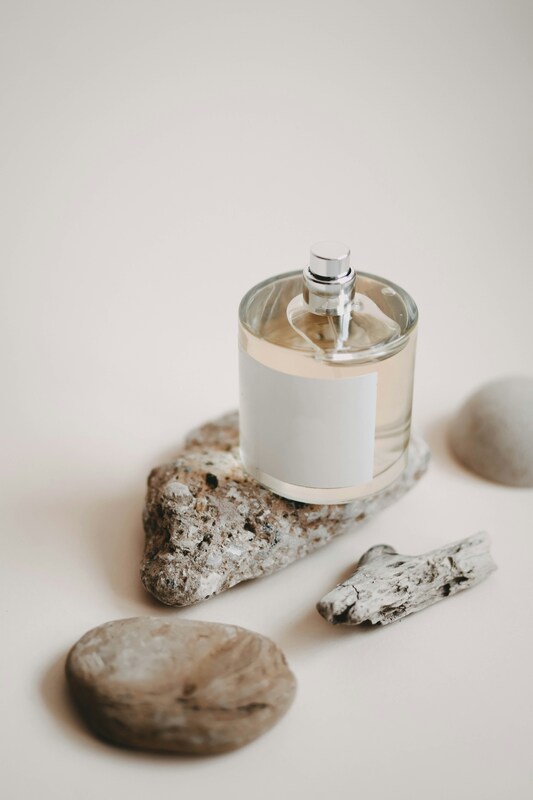Perfume bottle on natural surface